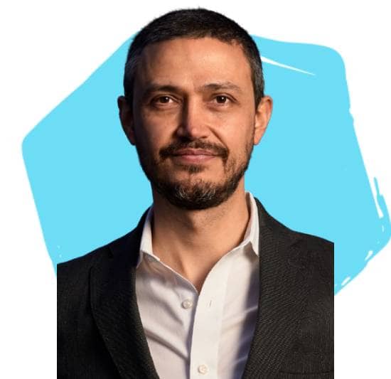 Boris Gartner, Board Director, in front of a light teal hexagon.